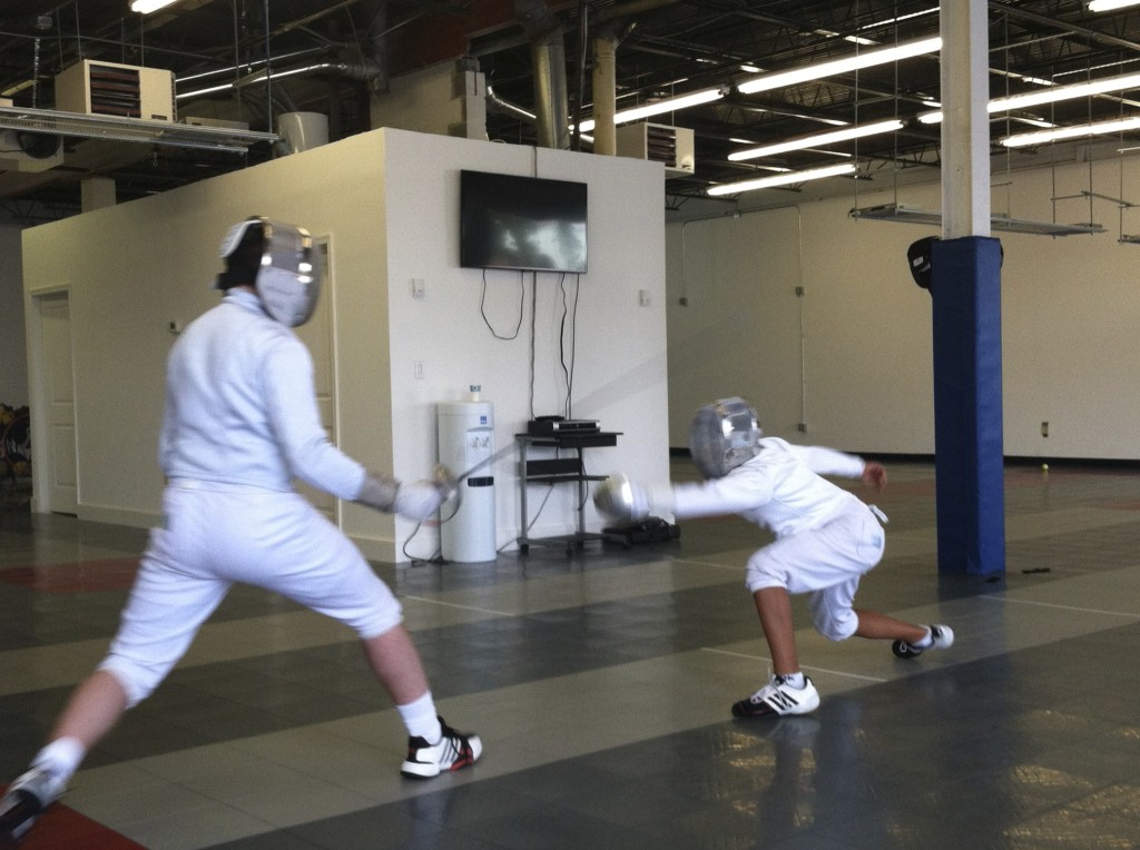 Sabre fencers practice before a tournament at Capital Fencing Academy in North Bethesda, Md. Photo by Barb DeLollis.
