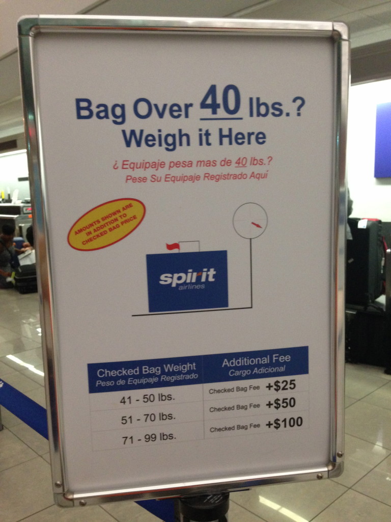 A sign at BWI shows Spirit Airlines' checked-bag rules.