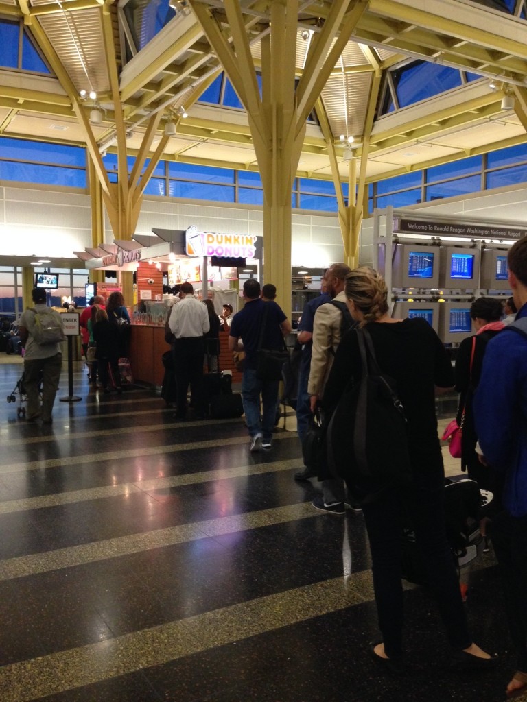 Long line at 6:30 a.m. today at the Dunkin Donuts stand at DCA's Terminal B. Travel Update photo by Barb DeLollis.