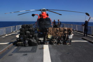 U.S. Coast Guard Cutter Spencer crew members secure the helicopter to the flight deck of the ship Saturday, Feb. 18, 2017. The Spencer returned from a 74-day Eastern Pacific ocean patrol after seizing $92 million in cocaine.(U.S. Coast Guard photo by Petty Officer 2nd Class Timothy Midas)