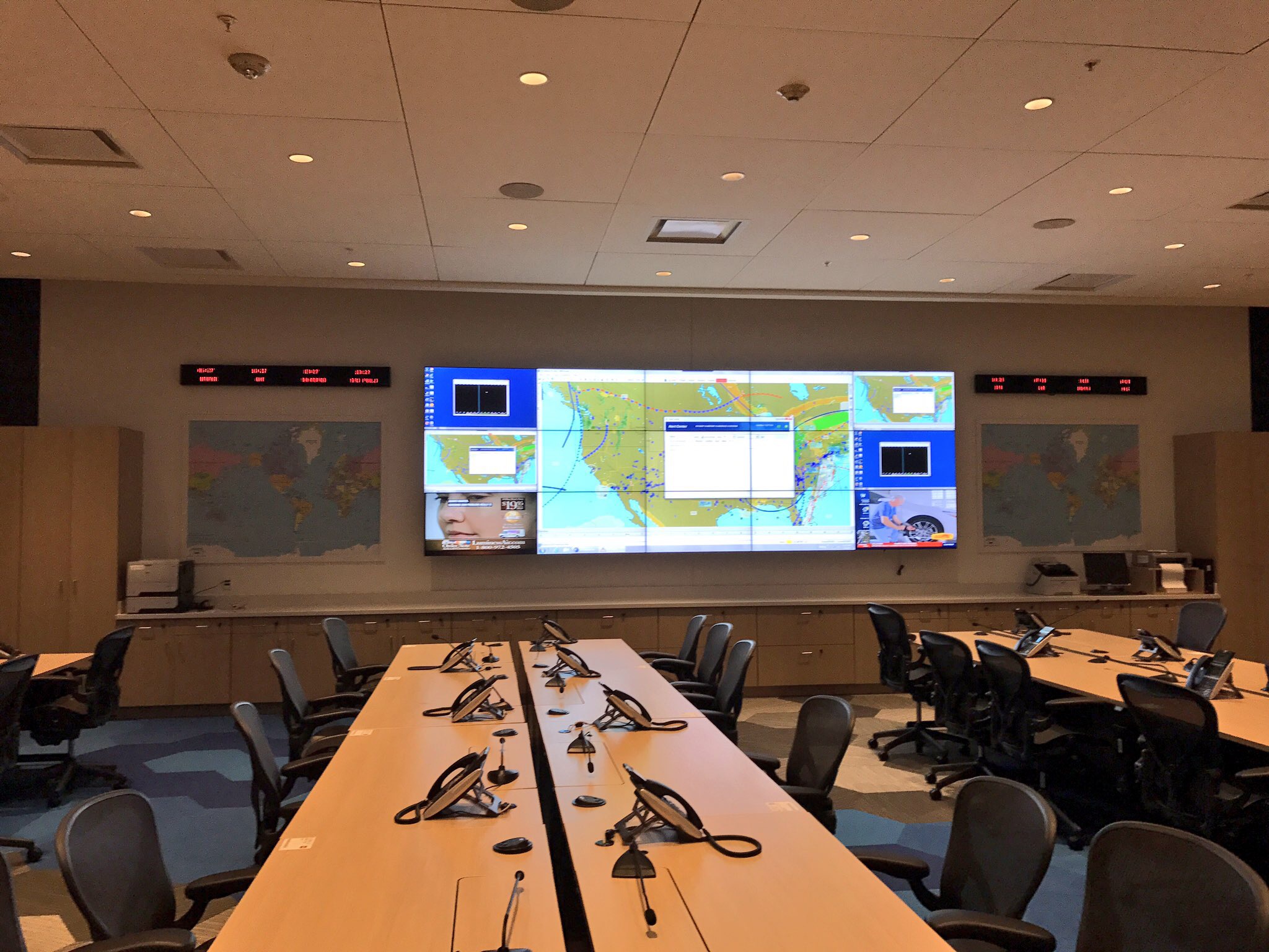 a large screen with a map on the wall